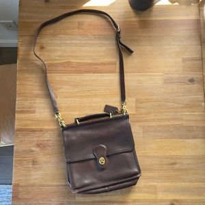 Rich brown leather messenger crossbody Coach bag.